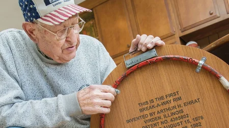 Arthur Ehrat, a farmer who barely followed basketball, built the rim that bends on every dunk. In 19