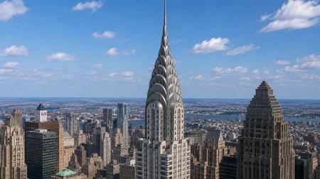 William Van Alen hid a 185-foot steel spire inside the Chrysler Building's own crown, assembled in s