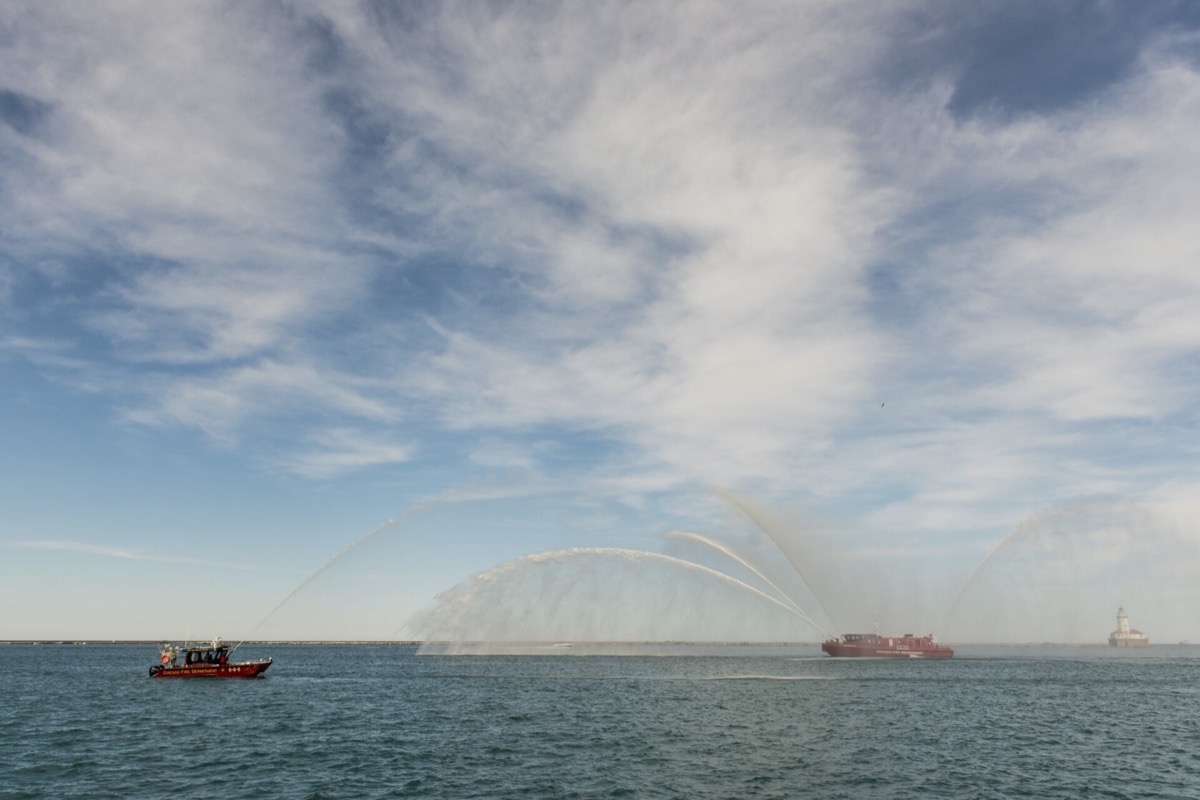 A modern fireboat spraying water, similar to the fireboat the Leary Firefighters Foundation funded for the Boston Fire Department