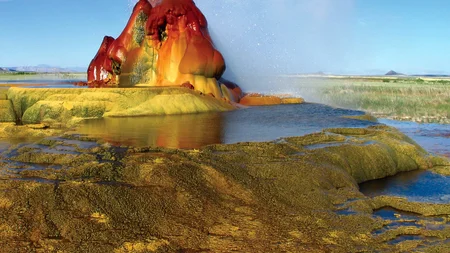 Fly Geyser looks like something from another planet, its mounds streaked bright red and green in the