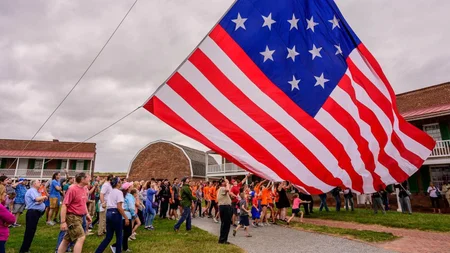 The flag that inspired the national anthem was 30 by 42 feet, with 15 stars and 15 stripes. At Fort 