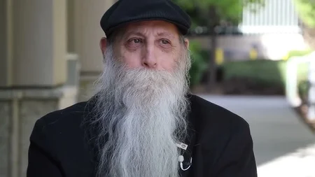 After Hal Goldblatt was struck by a car in a crosswalk and suffered a traumatic brain injury, his fa