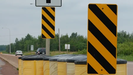 The yellow barrels at every highway exit were invented by John Fitch, a Le Mans driver who once shot