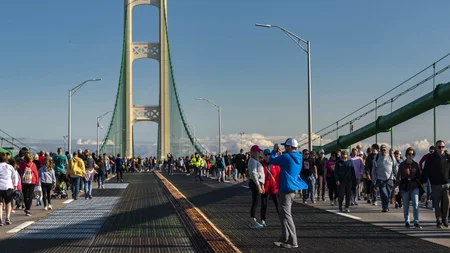 The Mackinac Bridge is Michigan's five-mile 'Mighty Mac.' Every day, only cars are allowed on it. Ex