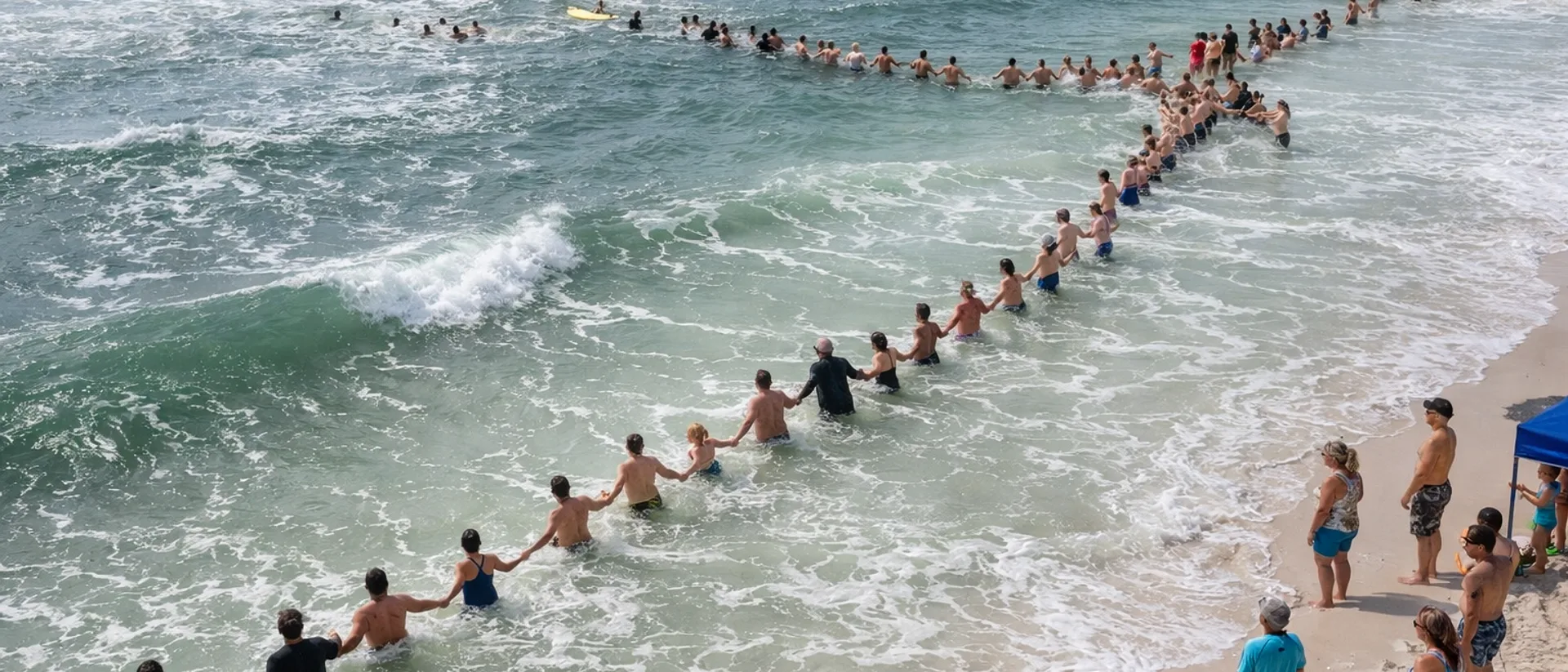 80 Strangers Formed a Human Chain Into the Ocean to Save a Drowning Family