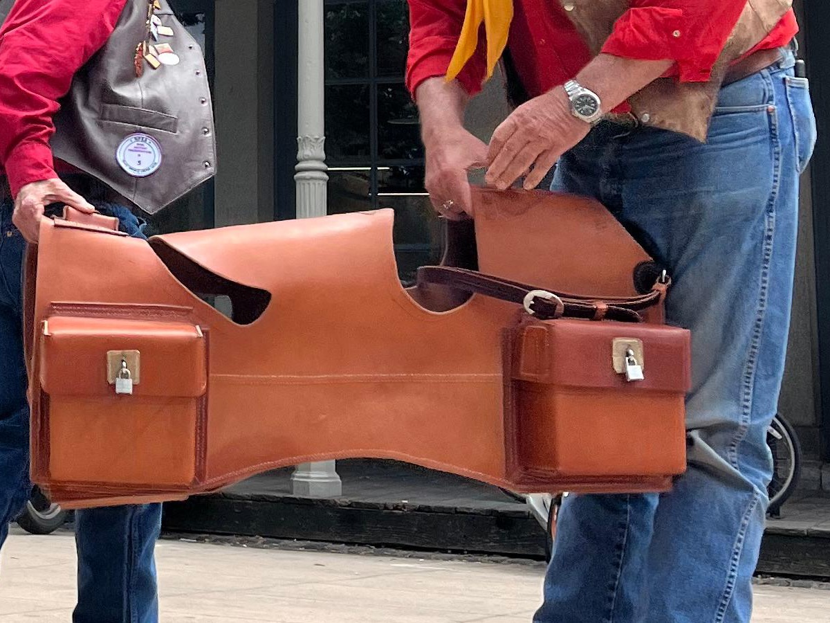 Close-up of a leather Pony Express mochila mail pouch with its four cantina pockets draped over a saddle