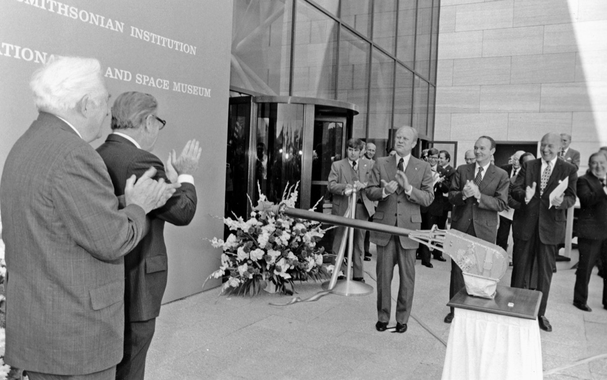 1976 photo of the National Air and Space Museum ribbon-cutting ceremony on the National Mall with President Gerald Ford and museum director Michael Collins