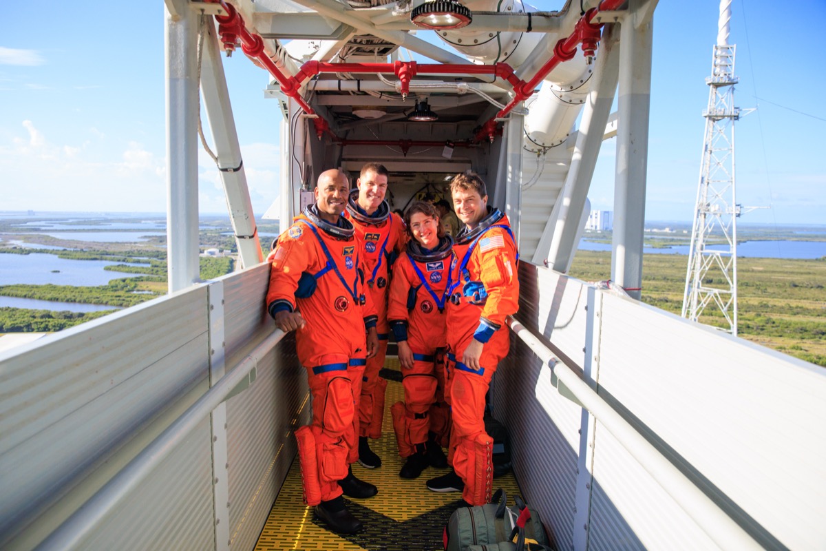 The Artemis II crew, from left, Victor Glover, Jeremy Hansen, Christina Koch and Reid Wiseman, on the crew access arm at Launch Pad 39B during a September 2023 rehearsal ahead of their Moon flyby mission