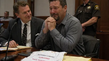 After a truck smashed into Timothy Kuhn's stationary car at 45 mph, his own insurer USAA - which had