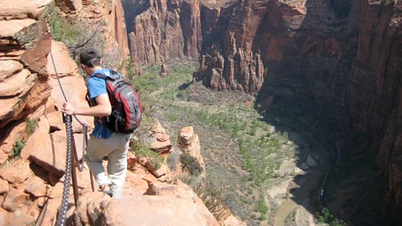 At Zion National Park, the last half-mile to Angels Landing runs along a knife-edge ridge. Drops of 